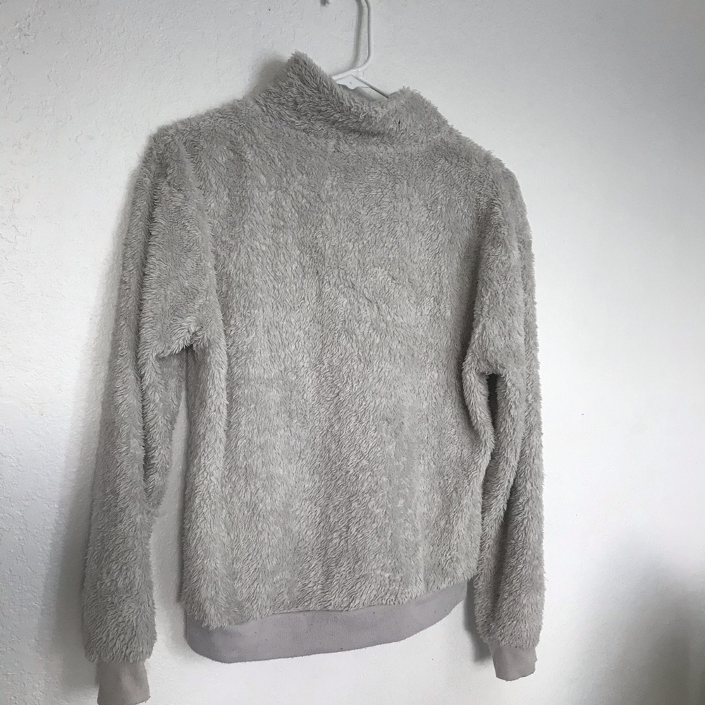 A gray fuzzy sweater